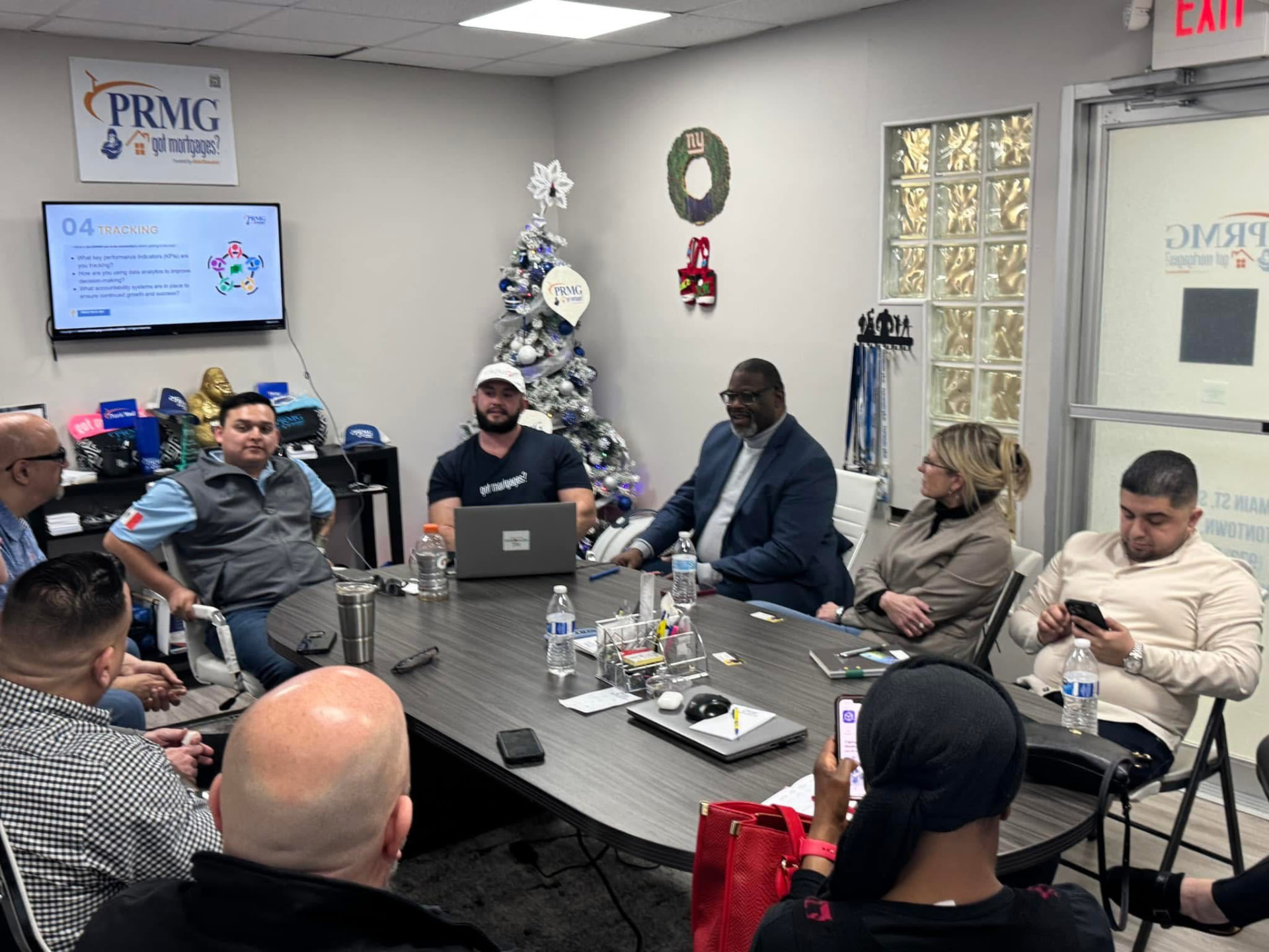 Attendees seated around a conference table for a roundtable discussion at a Got Mortgages office session