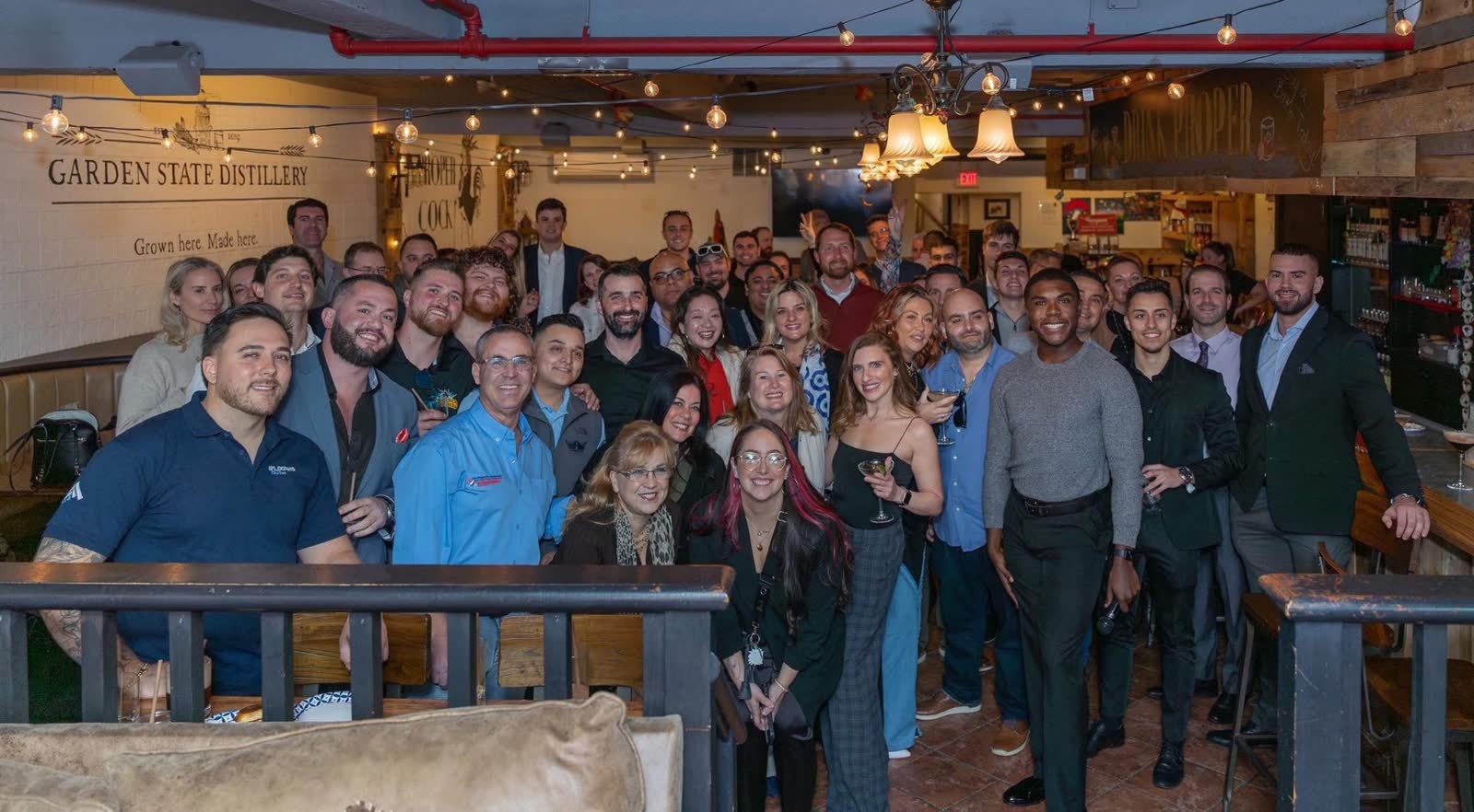 Community team gathering at Garden State Distillery